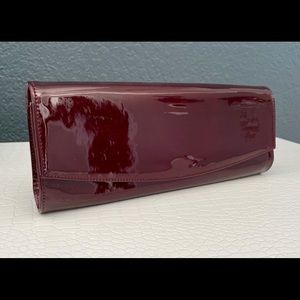 Stuart Weitzman clutch in burgundy color